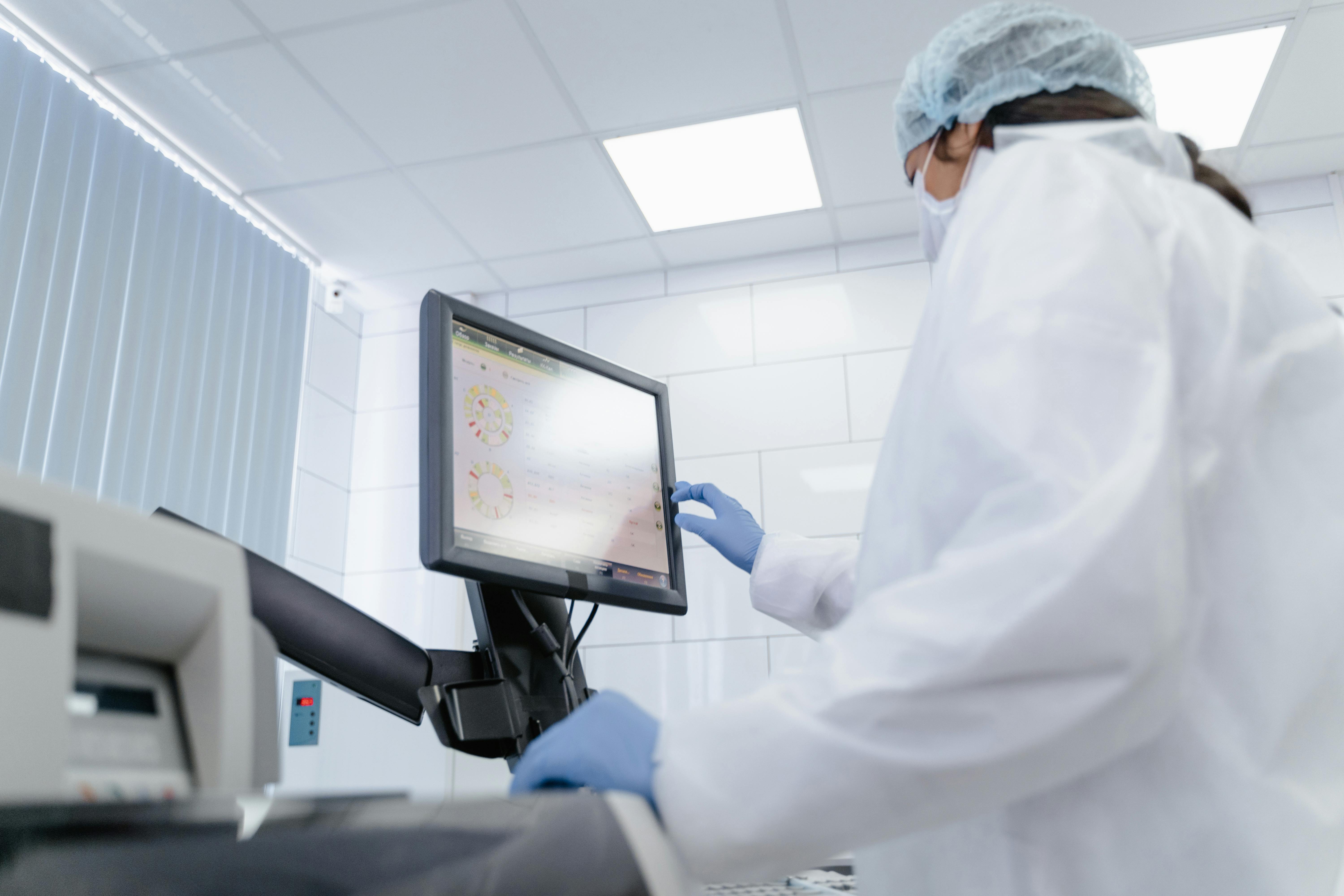 Medical cleanroom worker using a touch display